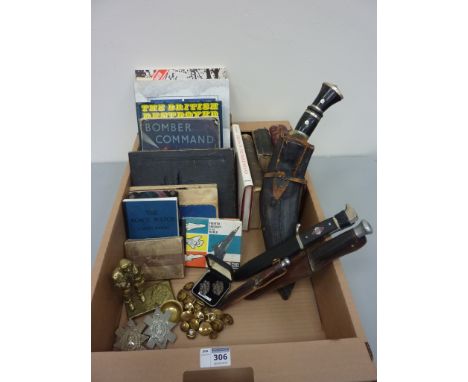 Kukri, replica WWII German dagger, two hunting knives, brass model of an airman, books and other military related ephemera in