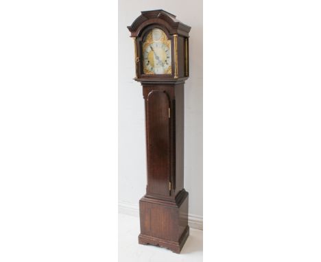 A 20th century mahogany-cased eight-day grandmother clock: 7-inch broken-arch brass dial with decorative engraving and signed