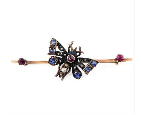 A late Victorian or Edwardian rose gold, silver, sapphire, ruby, seed pearl and diamond butterfly bar brooch, the central but