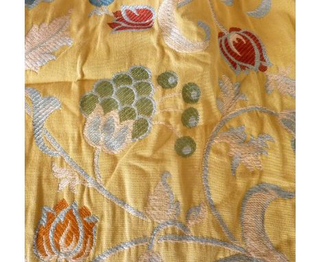 A pair of heavy yellow curtains with medieval-style floral design from Mulberry and Pierre Frey; pencil pleat heading, therma