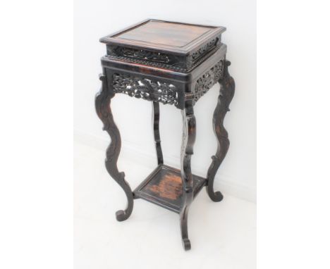 A late 19th century Chinese ebonised softwood&nbsp;jardini&egrave;re of square form: carved pierced friezes decorated with op
