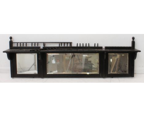 A late 19th century ebonised Aesthetic Movement set of shelves with three hand-bevelled mirror plates. (The shelf 167.5 cm wi