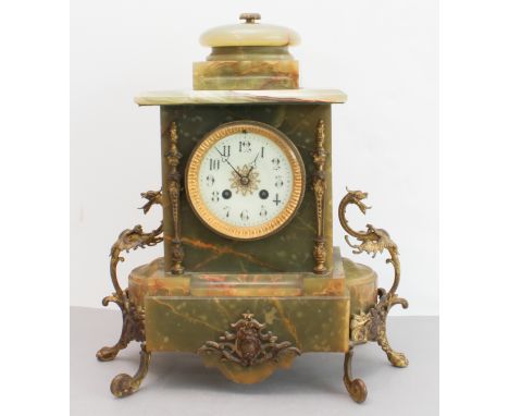 A late 19th century gilt-metal-mounted and onyx-cased eight-day mantle clock: the white enamel dial with Arabic numerals and 
