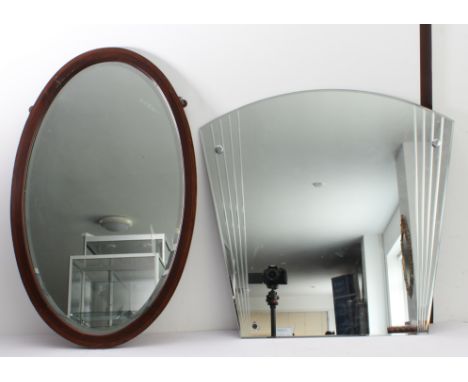 Two mirrors: 1. an early 20th century oval mahogany and boxwood-strung wall-hanging looking glass having hand-bevelled plate 