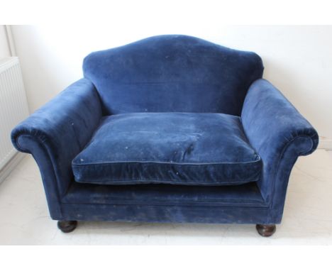 A modern cobalt-blue upholstered two-seater sofa by George Smith, Newcastle, England ( maker's label to underside), raised on