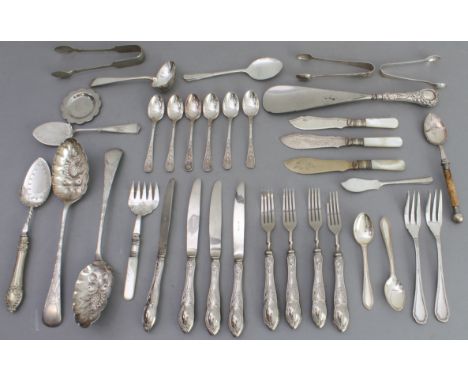 A selection of mostly silver-plated late 19th to early 20th century flatware to include: a silver-handled shoe horn; four des