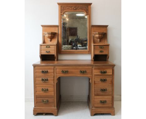 A good early 20th century satin maple dressing-table of large and impressive proportions: the central mirror with dentil corn