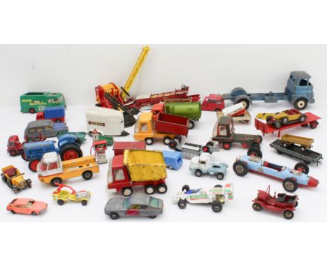 An assortment of unboxed Dinky, Matchbox, Tonka and Corgi die-cast models to include trailers, newer vehicles, parts and sing