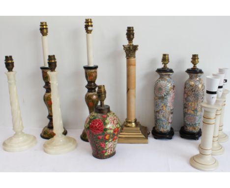 Eleven table lamps: a pair, onyx with wrythen stems; a set of three, white and gold-ringed ceramic; a pair, painted Indian wo