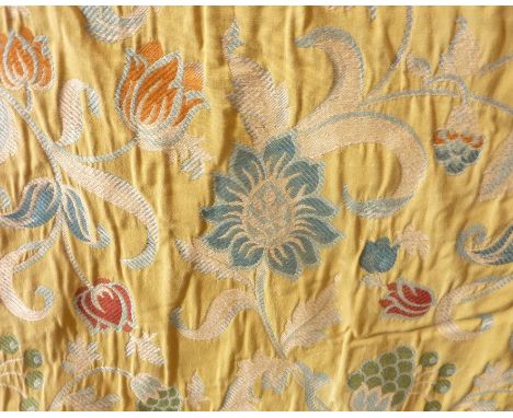 A pair of heavy, yellow curtains with medieval-style floral design from&nbsp;Mulberry and Pierre Frey; pinch pleat heading, t