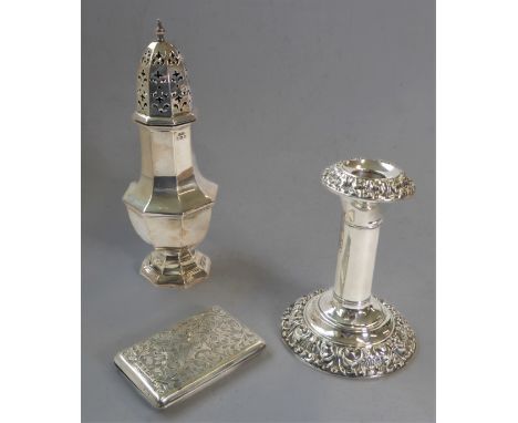 Three pieces of&nbsp;hallmarked silver: 1. an early 20th century caster of faceted baluster form; 2. a&nbsp; weighted candles