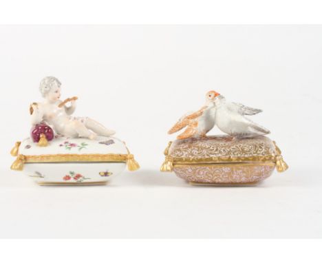 A 19th Century Berlin trinket box formed as two dogs on a cushion, 4" wide, and a companion trinket box with cupid, 4" wide (