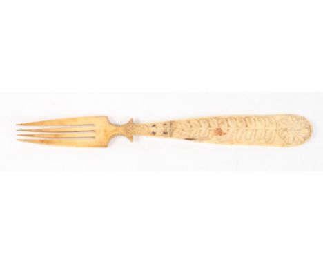 A 19th Century prisoner of war carved bone fork, 10 1/2" long