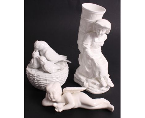 A 19th Century white glazed china spill holder in the form of a peasant lady with a grape basket, 6" high, a similar figure o