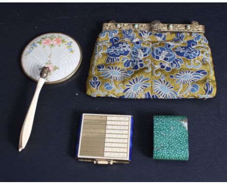 An embroidered evening purse with gilt metal mounts, a shagreen effect travelling clock, a compact and a hand mirror