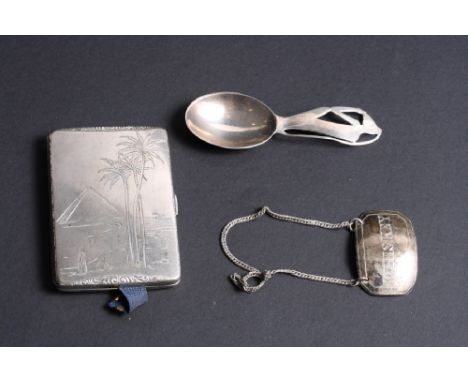 An 830 standard cigarette case, cover engraved pyramid and palm trees, a silver caddy spoon, handle pierced a monkey, a "Whis