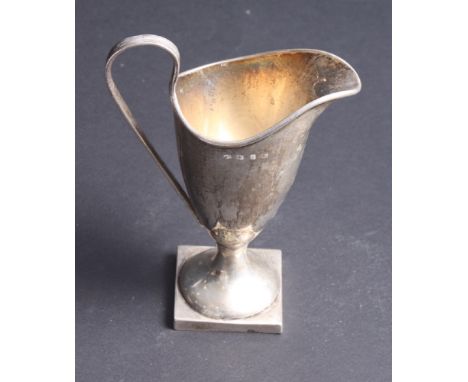 A George III design plain silver helmet cream jug on square base with reeded handle, 6" high, 4.3oz troy approx