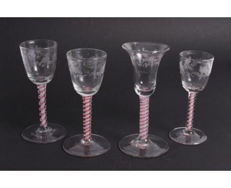 Three 18th Century wine glasses with ogee bowls engraved birds and blossom on red and white opaque series stems and a matchin