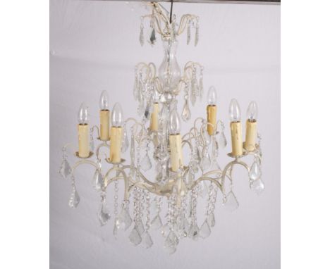 A cream painted metal eight-light chandelier hung leaf-shaped cut glass drops, 36" high