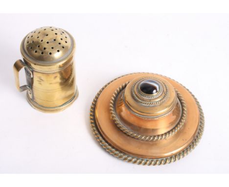 A copper circular inkwell decorated rope twist bands, hinged cover inset cabochon agate, and a brass flour sifter