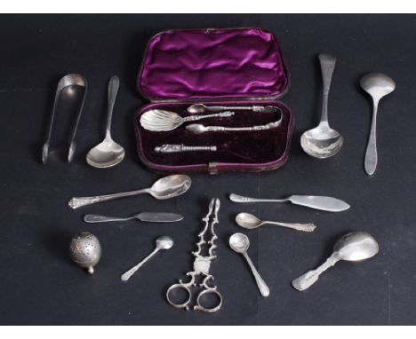 A pair of Georgian silver sugar tongs, a silver caddy spoon, a silver pepper pot and a quantity of silver flatware, various, 