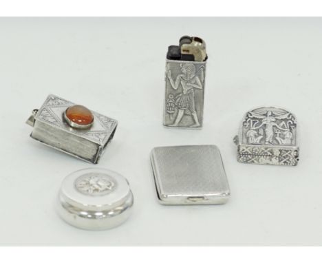 A collection of silver miniatures / objects de vertu, comprising of a vesta case, a lighter holder and three boxes. (5)Ασημέν