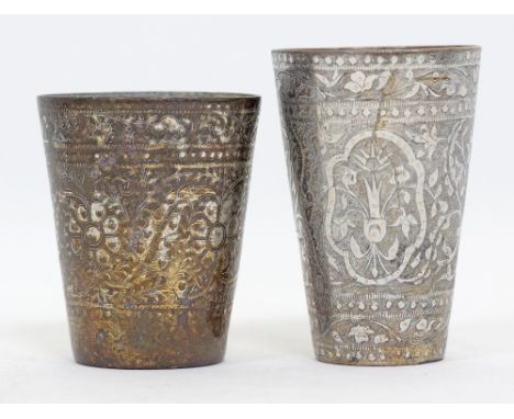 Two Middle Eastern / Persian tinned copper cups / glasses with intricate chiseled decoration. H10cm and H12cm. 19th century. 