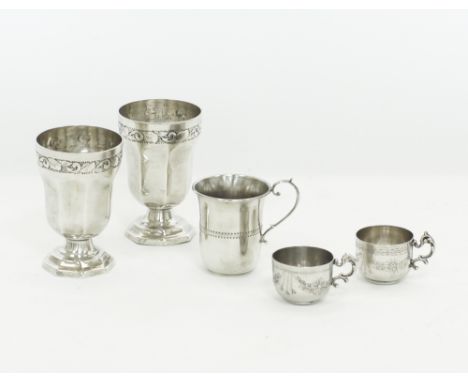 A collection of vintage Middle Eastern silver goblets and cups, with repoussé and chiseled decorations. The two goblets H11cm