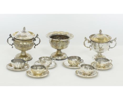 A collection of vintage Middle Eastern white metal trophy cups and covers H16cm, together with a set of six coffee cups and s