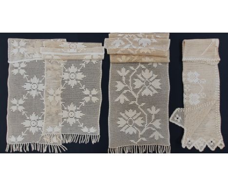A Cypriot set of four hand crocheted curtains measuring 104x120cm,45x185cm, 50x110cm and 50x110cm, all with a fringe hem. (4)