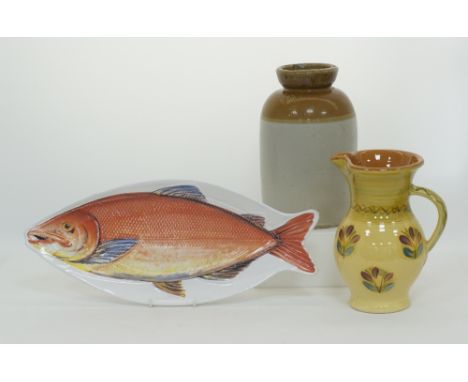 A large English ceramic jar H30cm, a hand painted ceramic pitcher H27cm and an Italian ceramic fish serving dish L54cm. (3)Κε