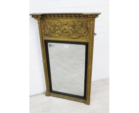 Giltwood wall mirror, the inverted breakfront top with ball finials above a leaf carved frieze, with a rectangular plate, 