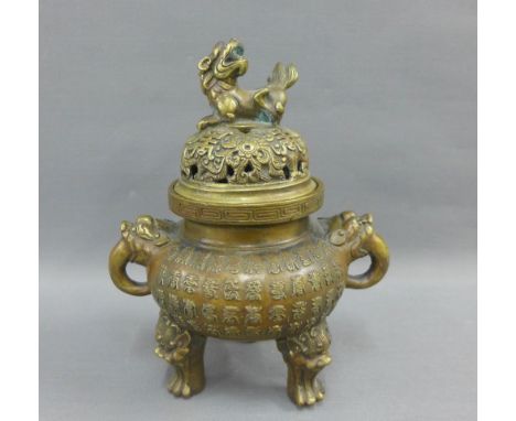 Chinese bronze censor, the pierced cover with a temple lion finial, on three paw feet, 19cm high 
