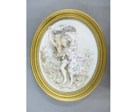 Bisque pottery oval plaque depicting two dancing  figures, 40 x 35cm 