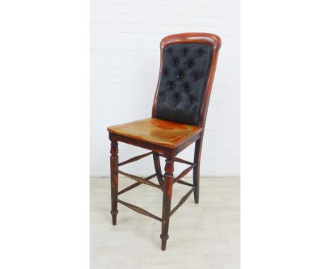 19th century Clerks chair of extra tall proportions, with upholstered button back, solid seat, turned legs and two sets of st