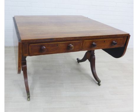 19th century rosewood and inlaid sofa table, with two drop leaves, shaped side supports with brass caps and castors,  72 x 11