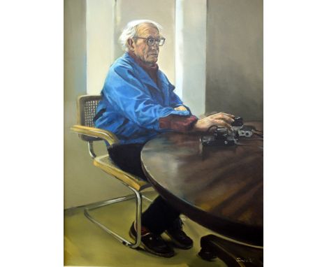 § Michael Smee (British, b1946), portrait of John Humphrey Spender seated at a table holding a camera,  oil on canvas , signe