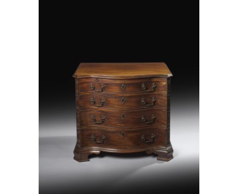 A small George III mahogany serpentine chest, the top with a moulded edge, above a baize lined brushing slide and four long g