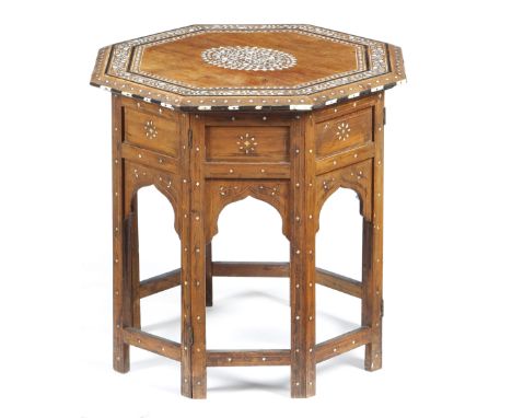 λ An Anglo-Indian hardwood occasional table, inlaid with ivory, bone and ebony with scrolling leaves and flowers, the octagon