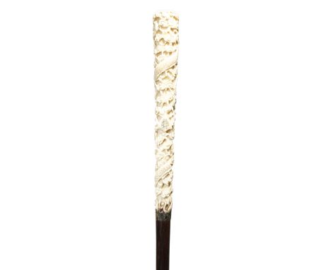 λ A late 19th century swagger stick, the Chinese ivory handle carved with scaly dragons and with a monogram 'RSI', with an eb