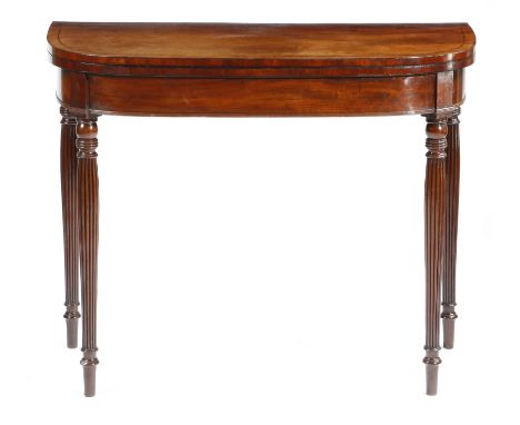 A Regency 'D' shaped tea table, inlaid with ebonised stringing, the hinged fold-over top on twin gate supports, on ring turne