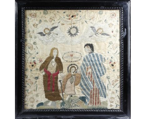An early 18th century embroidered silkwork picture, worked with the Holy family, Joseph and Mary accompanying young Jesus who