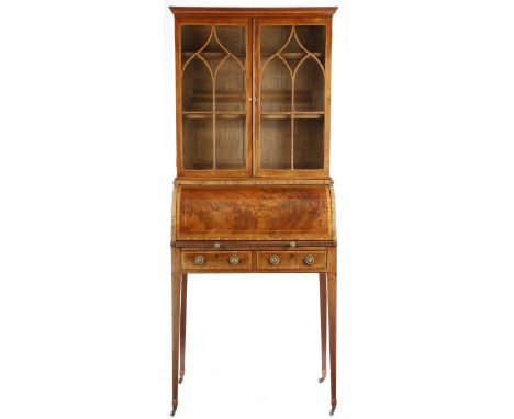 A George III and later mahogany cylinder bureau bookcase, inlaid with stringing and satinwood banding, with a pair of lancet 