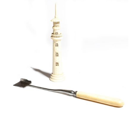 λ A Victorian carved bone model of a lighthouse, the screw-off base with an inner thread originally for a corkscrew, together