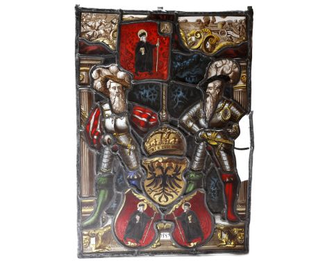 A German stained glass panel in 16th century style, decorated with a pair of armour clad knights flanking a double headed eag