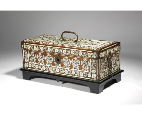 λ A Mughal Indian rosewood and ivory casket, with brass mounts, inlaid with panels of flowers and borders of scrolling leaves