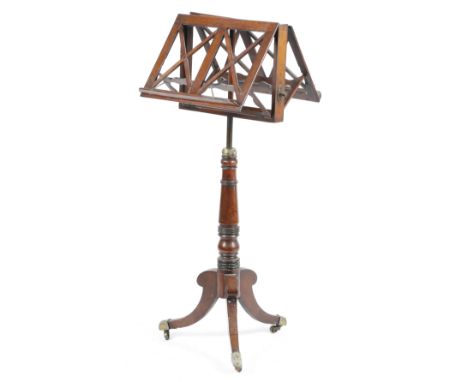 A George IV mahogany duet music stand, the hinged lattice rests on an adjustable stem (now fixed), on a ring turned baluster 