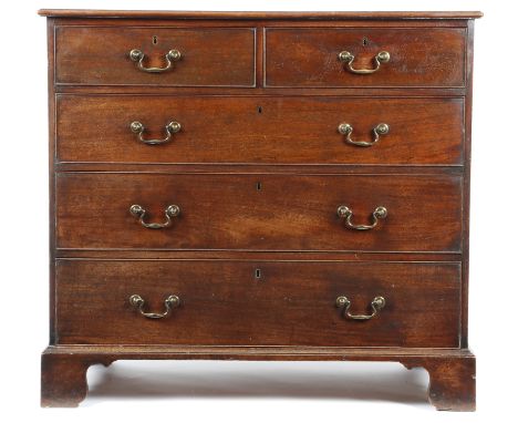 A George III mahogany chest, the moulded edge top above two short and three long graduated drawers, on shaped bracket feet, 1