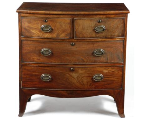 A Regency mahogany bowfront chest, of two short and two long drawers, with oval brass handles decorated with a hunting scene,