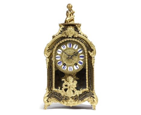 A late 19th century French boulle marquetry mantel clock in Louis XIV style, the eight day brass movement striking on a bell,